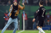 Hamburg Pitch invader wacks Franck Ribery with his scarf