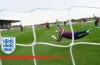 Henderson smashes a goal past Hart in England training