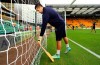 Reading’s Aussie keeper Adam Federici puts a bat out near his net in memory of Phil Hughes