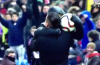 Diego Simeone celebrates Atletico scoring in the Madrid derby with his ball boy son