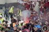 Right in the thick of it as Juventus Ultra’s lob homemade bomb at Torino fans