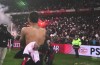 Memphis Depay celebrating PSV league title by giving a pitch invader a big squeeze