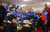 From a steamy changing room Bournemouth players celebrate winning the Championship