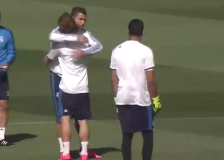 Free hugs: Cristiano Ronaldo gives teammates a cuddle during Real Madrid training