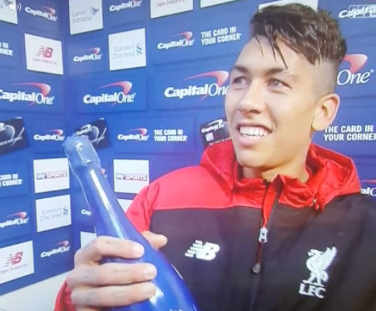 Roberto Firmino can’t quite believe he gets a bottle of bubbly as a MoM award