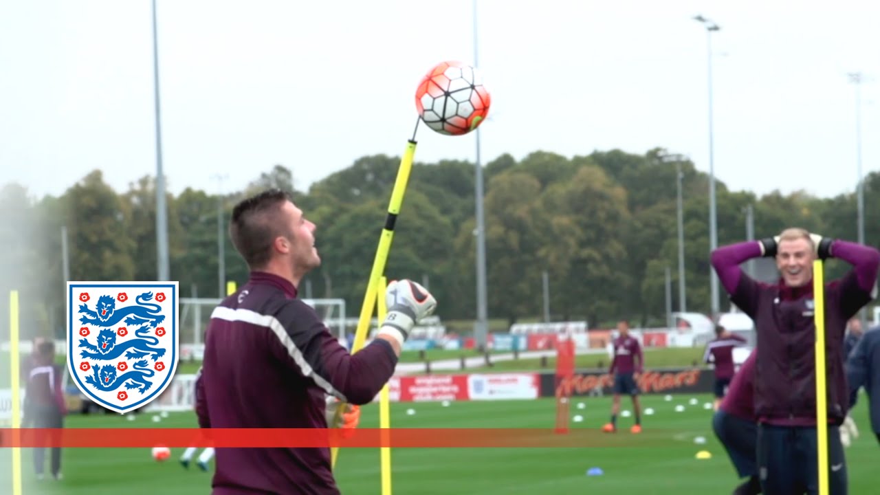 England goalkeeper coach some how impales ball on a spike