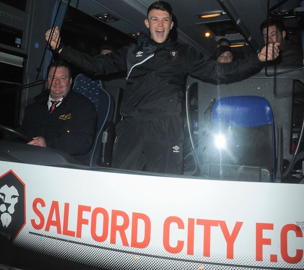 Steve Evans moonlighting as Salford City's bus driver